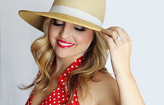 Smiling Blonde Woman in Straw Hat and Red Polka Dot Dress