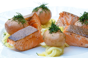 Pan-seared salmon fillets with boiled potatoes and dill