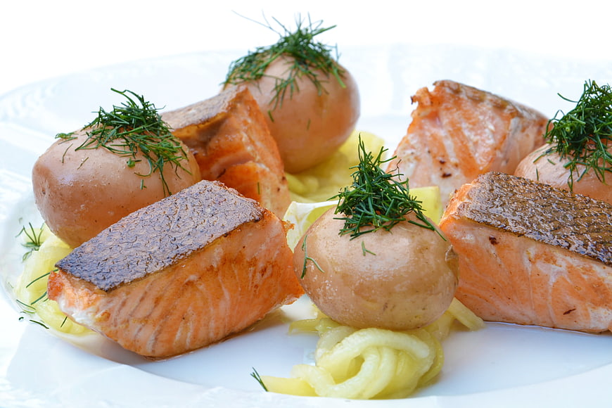 Pan-seared salmon fillets with boiled potatoes and dill