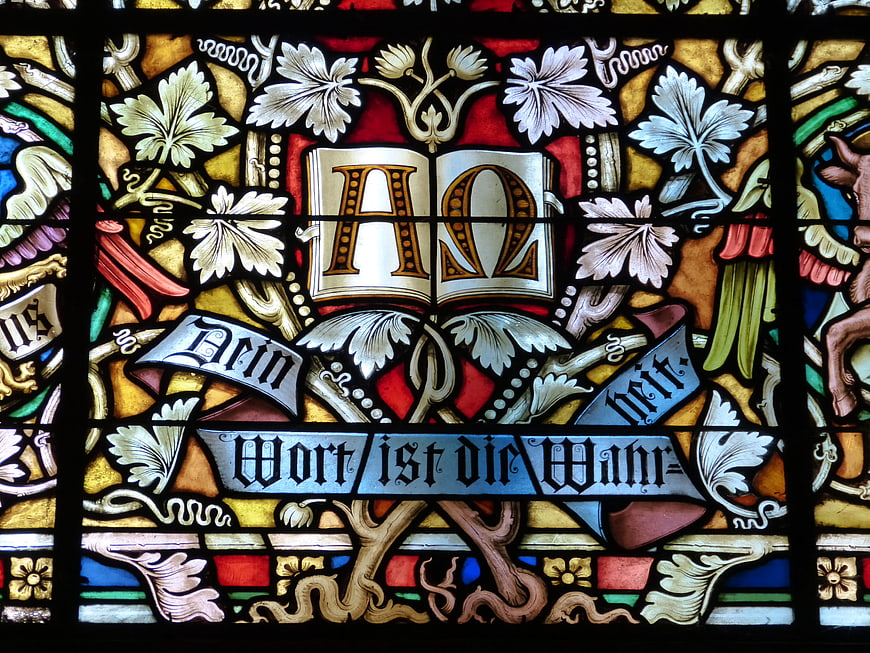 Stained Glass Window with Alpha Omega and German Text