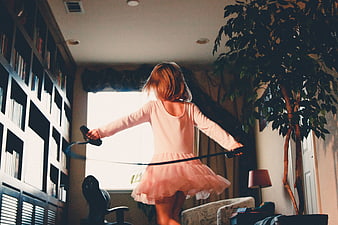 Little Girl Jumping Rope in Living Room