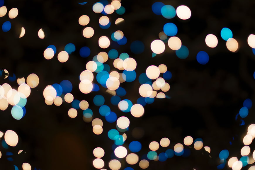 Abstract Blue and Gold Bokeh Lights on Dark Background