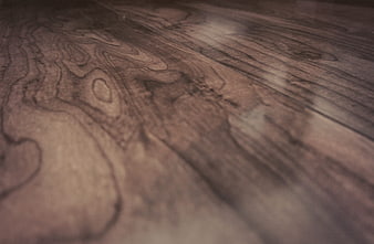 Close-up of dark wood grain texture with natural patterns