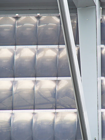 Abstract industrial metal wall with diagonal beam and reflections