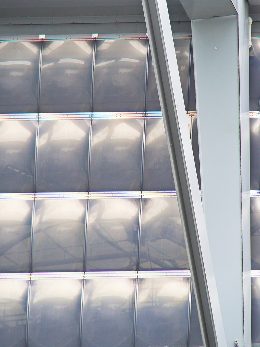 Abstract industrial metal wall with diagonal beam and reflections