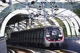 Modern MTR Train Arriving At Elevated Hong Kong Station