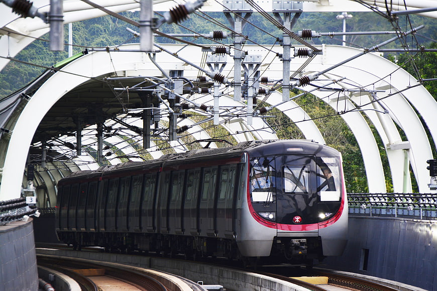 Modern MTR Train Arriving At Elevated Hong Kong Station