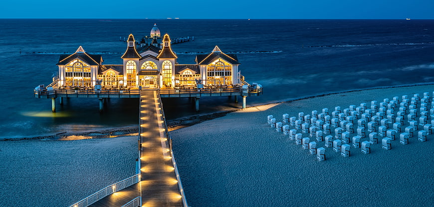 Aerial View of Illuminated Sellin Pier and Beach Cabins at Dusk
