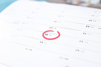Close-up of calendar with circled date 18 SA