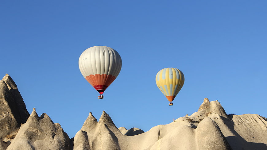 Hot Air Balloons Flying Over Cappadocia Rock Formations