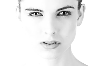High-Key Black and White Close-Up Portrait of a Young Woman