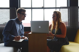 Young Business Team Collaborating With Laptop In Modern Office