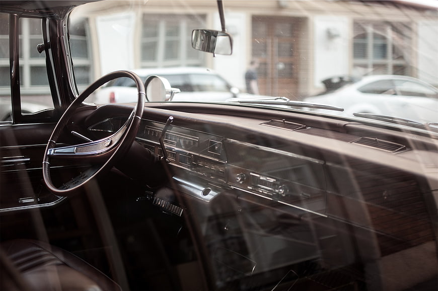 Vintage Car Interior Dashboard and Steering Wheel View