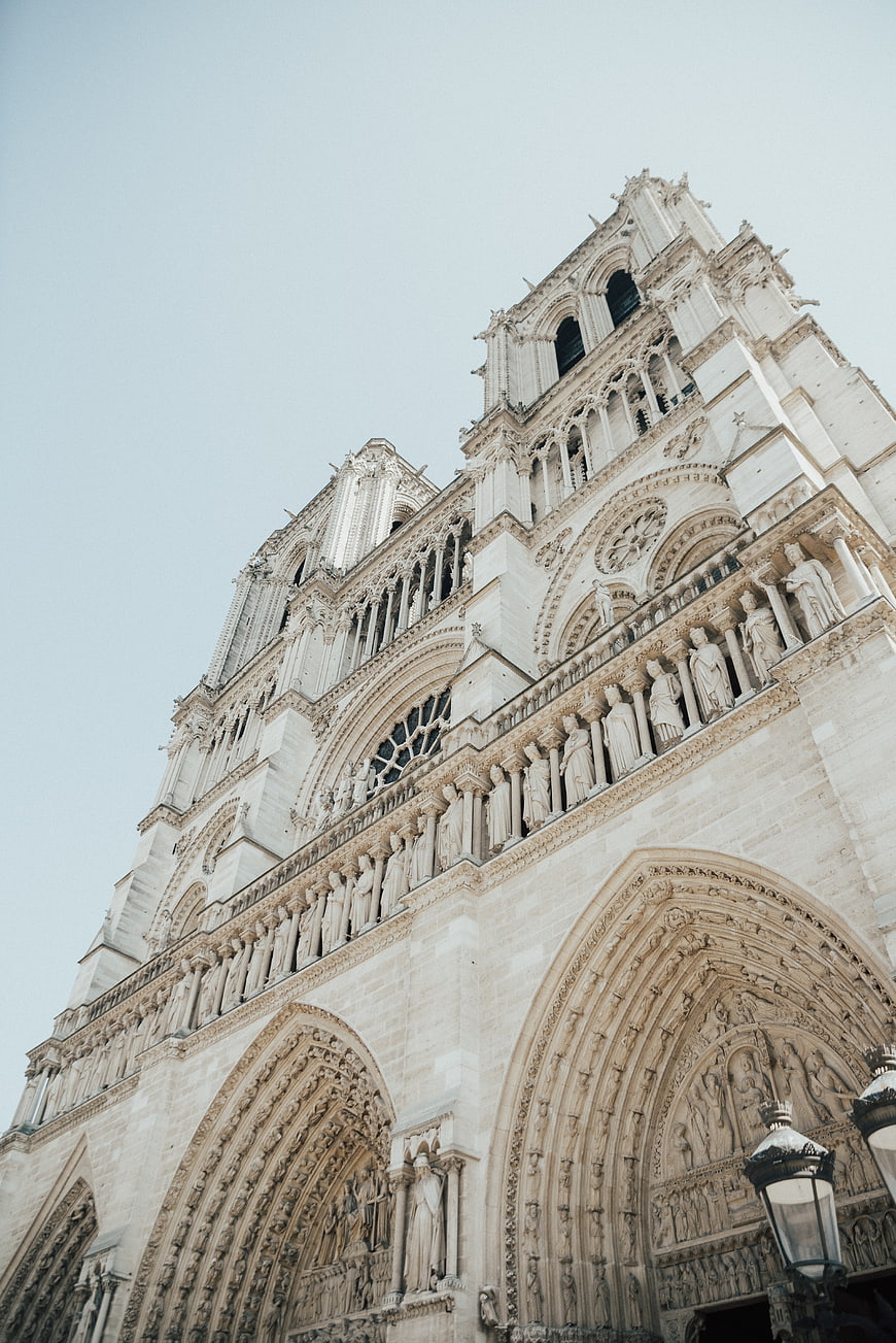 Low angle view of Notre Dame Cathedral facade in Paris