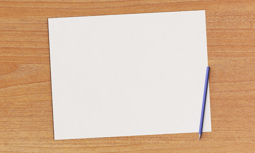Blank white paper and blue pencil on wooden table