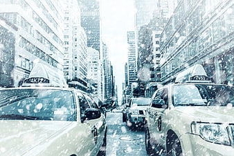 Yellow Taxis in Snowy New York City Street