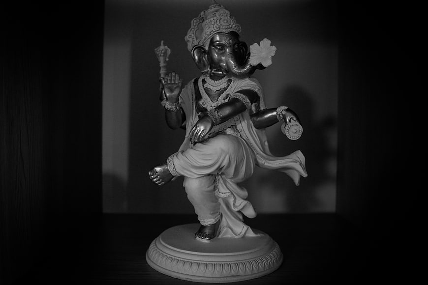 Black and White Ganesha Statue on Dark Background