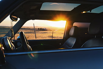 Sunset View from Car Interior with Rural Landscape