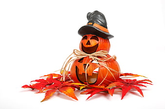 Stacked Halloween Pumpkins with Witch Hat and Autumn Leaves