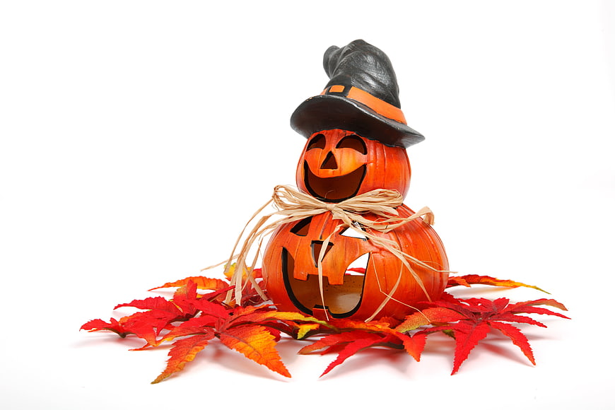 Stacked Halloween Pumpkins with Witch Hat and Autumn Leaves