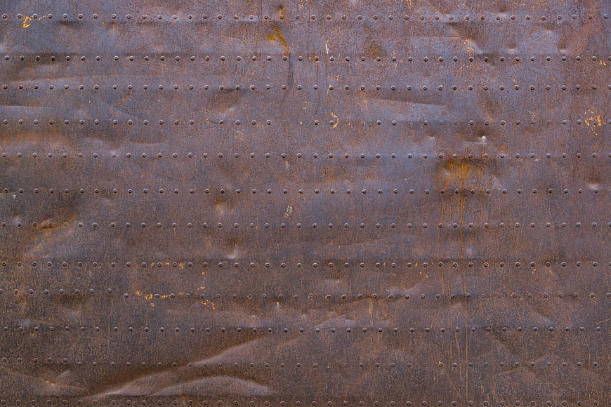 Rusted Metal Texture with Rivets Background