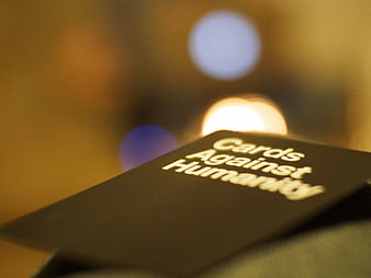 Cards Against Humanity box with bokeh background