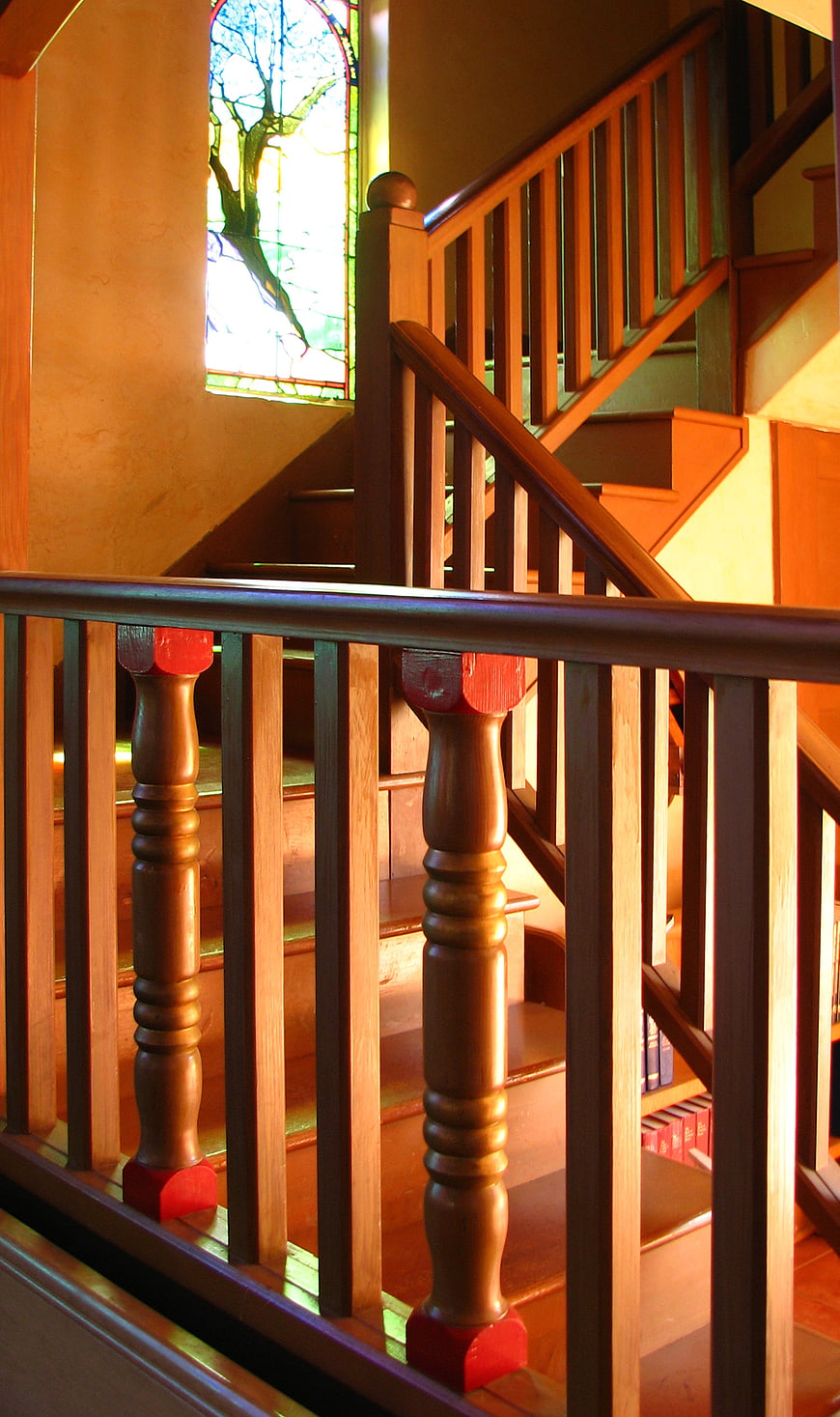 Wooden Staircase with Stained Glass Window