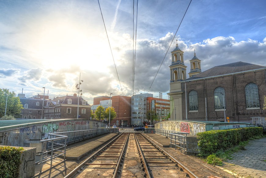 Tram tracks leading to church in Amsterdam Waterlooplein