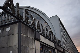 Alexanderplatz sign and curved building facade in Berlin