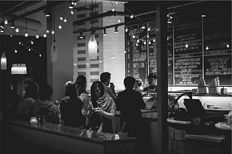 Black and white photo of people ordering at an ice cream shop