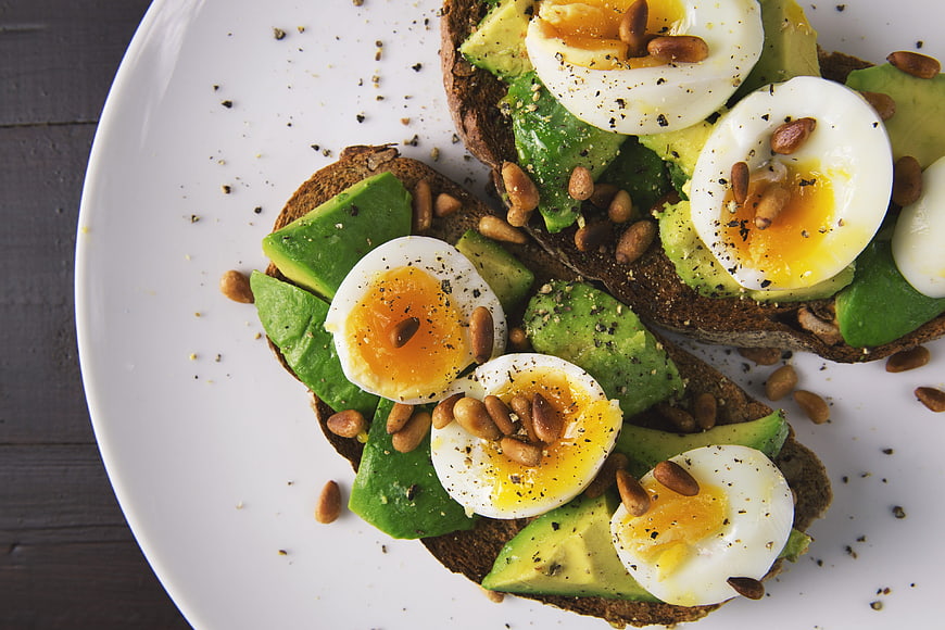 Avocado Toast with Soft Boiled Eggs and Pine Nuts