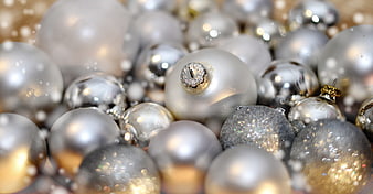 Close-up of silver and gold Christmas baubles with shallow depth of field