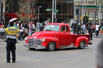 Classic Red Chevrolet Pickup Truck In Urban Street Parade