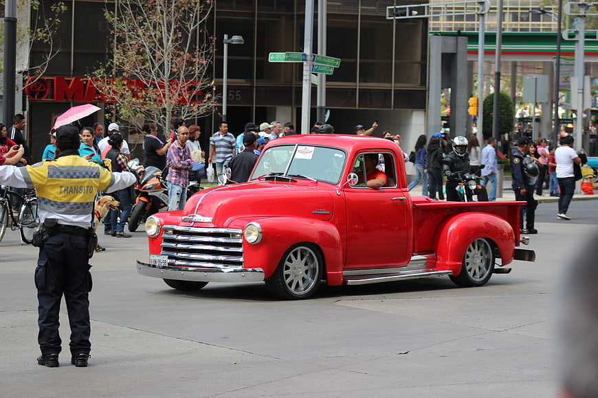 Classic Red Chevrolet Pickup Truck In Urban Street Parade