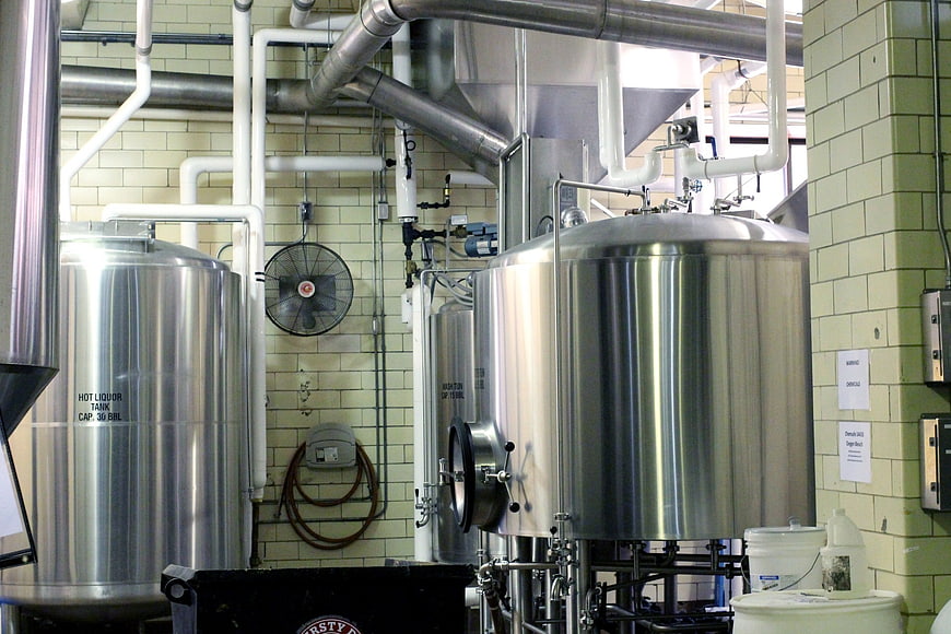 Stainless steel brewing tanks in industrial brewery interior