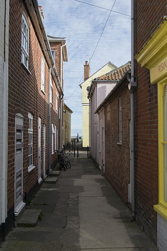 Narrow brick alleyway in Aldeburgh, Suffolk, England