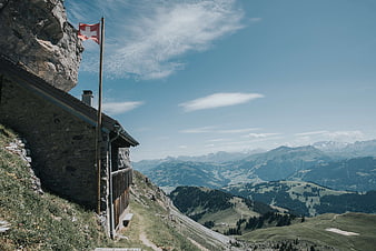Swiss Mountain Cabin with Flag and Alpine View
