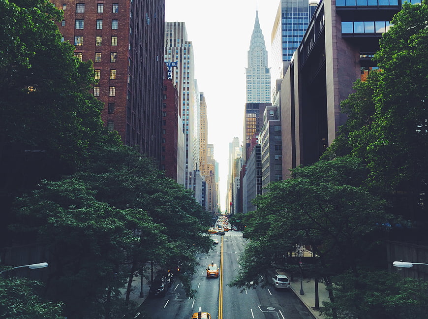 New York City street view with Chrysler Building and yellow taxis