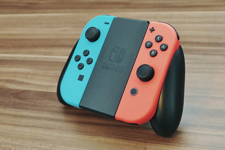 Nintendo Switch Joy-Con Controller on Wooden Table