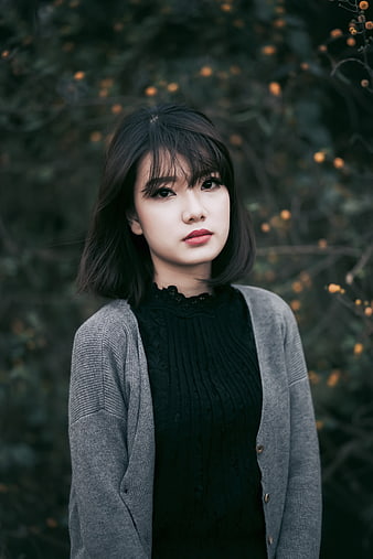 Portrait of Asian Woman in Grey Cardigan Outdoors