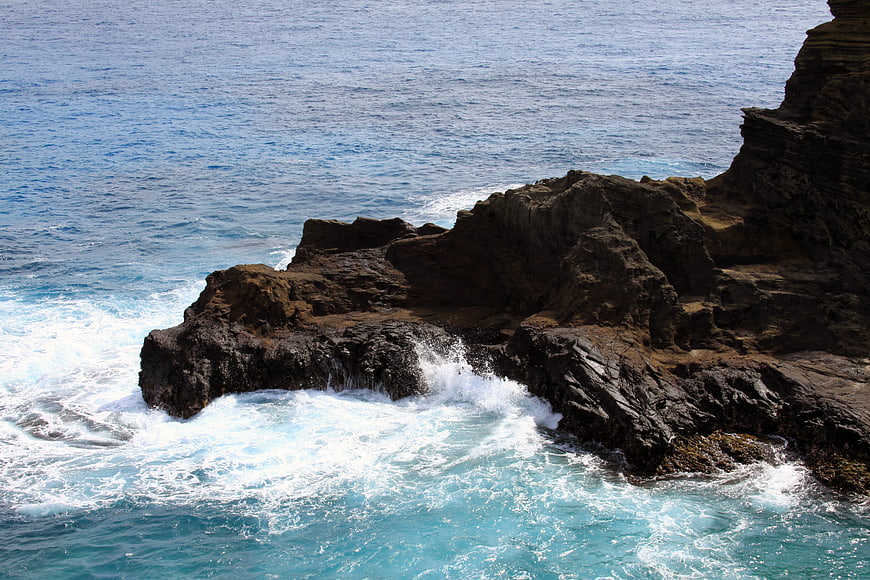 Ocean Waves Crashing Against Rocky Coastal Cliffs
