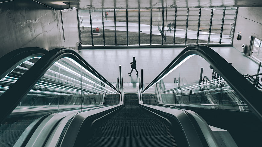 Symmetrical View of Escalators in Modern Building