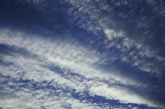 Dramatic blue sky with textured altocumulus clouds
