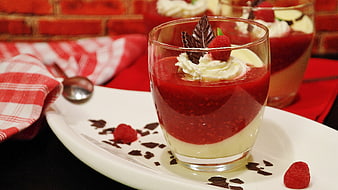 Raspberry and Vanilla Pudding Dessert in Glass with Chocolate Garnish