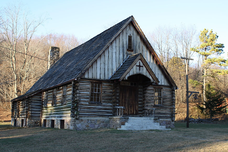 Historic Log Church in Rustic Winter Landscape