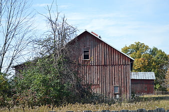 Weathered Red Barn in Rustic Autumn Farm Landscape
