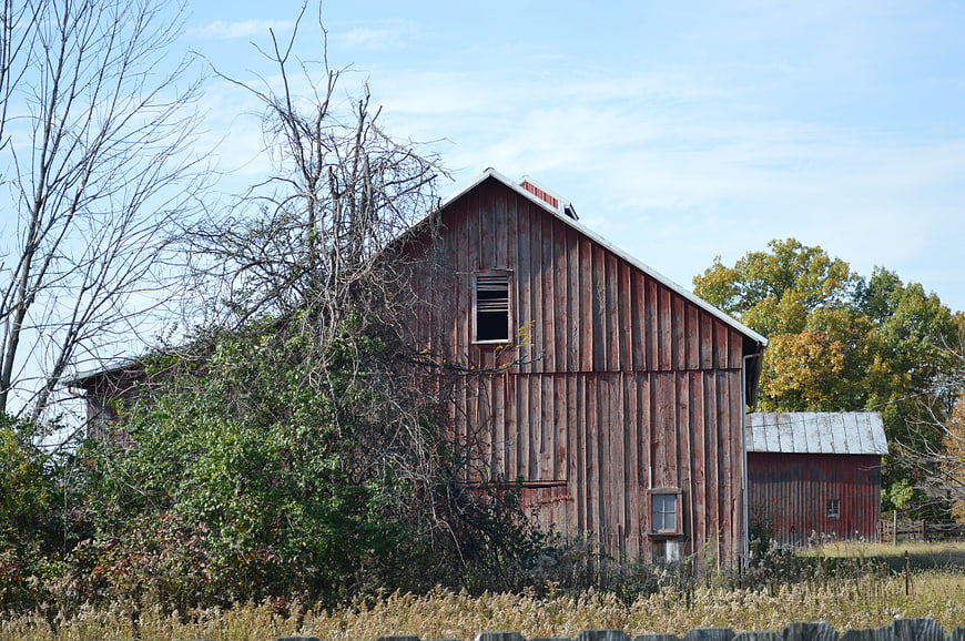 Weathered Red Barn in Rustic Autumn Farm Landscape