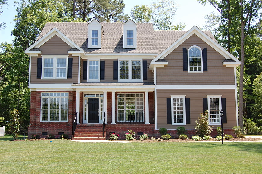 Modern two-story suburban home with brick and siding exterior