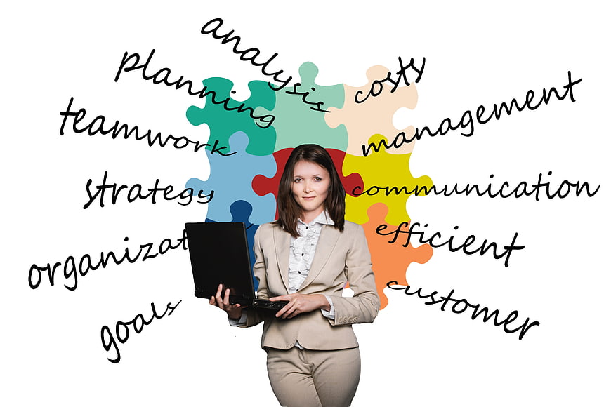Businesswoman with laptop and puzzle pieces representing strategy and teamwork