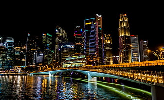 Singapore skyline at night with Helix Bridge and Marina Bay